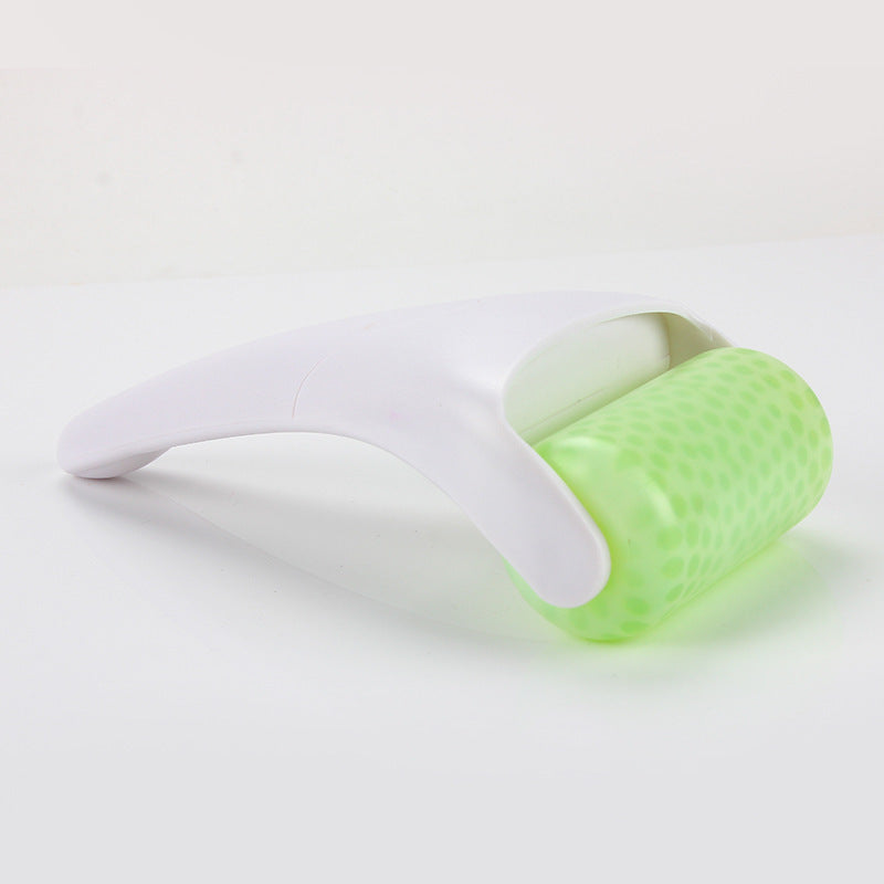 Ice roller face massage tool gliding across facial skin