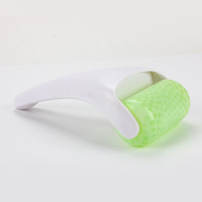 Ice roller face massage tool gliding across facial skin